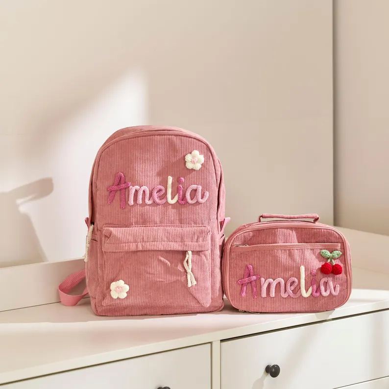 Real pink set: backpack and lunch bag with Amelia in pink and cream yarn letters