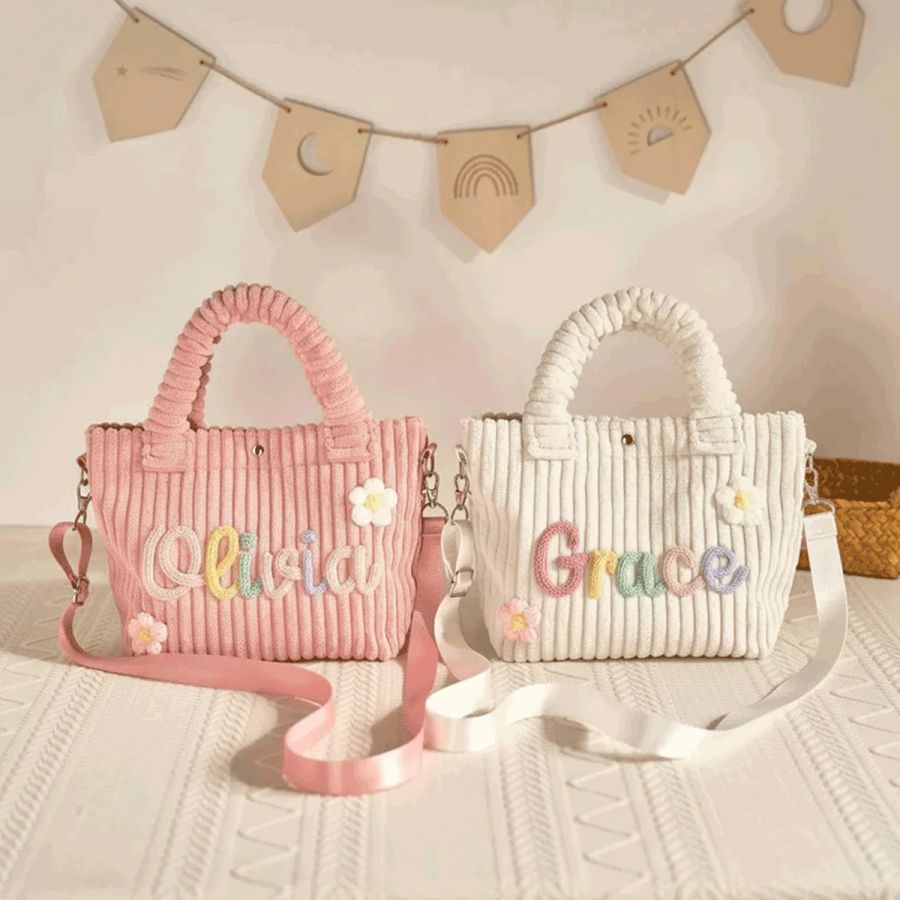 Close-up of real yarn letters: Olivia and Grace in pastel multi-colour