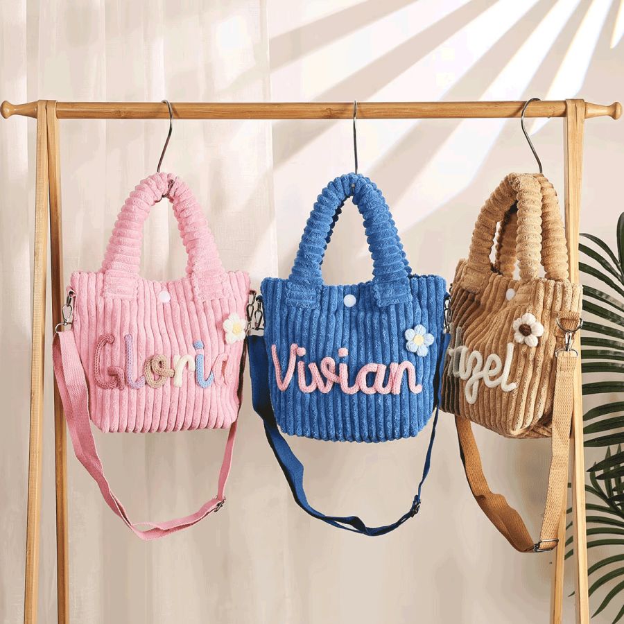 Personalised corduroy toddler purses in pink, blue and khaki with names in yarn letters
